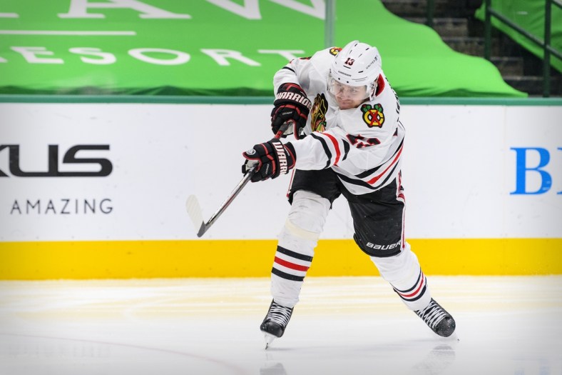 Mar 11, 2021; Dallas, Texas, USA; Chicago Blackhawks center Mattias Janmark (13) in action during the game between the Dallas Stars and the Chicago Blackhawks at the American Airlines Center. Mandatory Credit: Jerome Miron-USA TODAY Sports