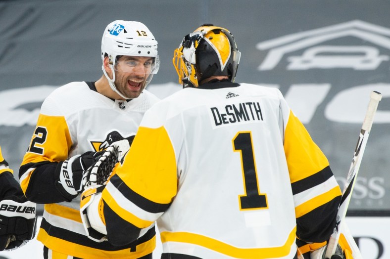 Apr 1, 2021; Boston, Massachusetts, USA; Pittsburgh Penguins forward Zach Aston-Reese the (12)  celebrates with goaltender Casey DeSmith (1) after getting a win against the Boston Bruins at TD Garden. Mandatory Credit: Kathryn Riley-USA TODAY Sports