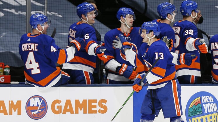 Apr 1, 2021; Uniondale, New York, USA; New York Islanders center Mathew Barzal (13) is congratulated after scoring his third goal of the game for a hat trick against the Washington Capitals during the third period at Nassau Veterans Memorial Coliseum. Mandatory Credit: Andy Marlin-USA TODAY Sports