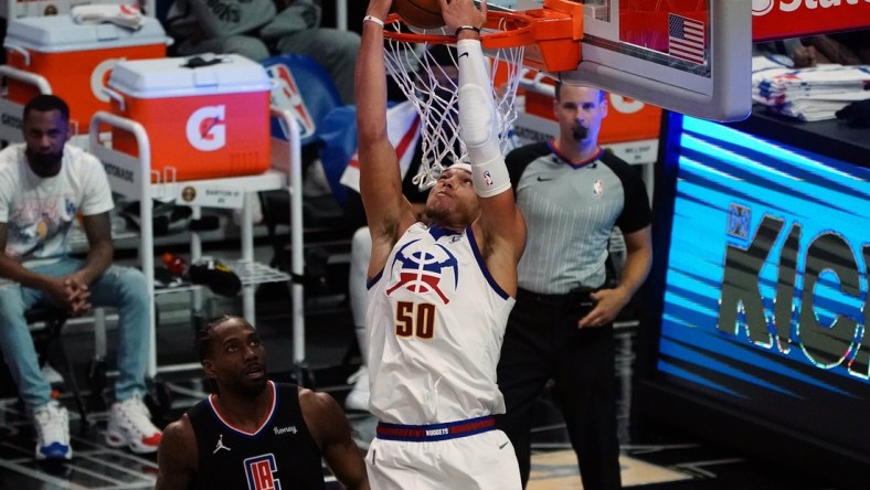 Apr 1, 2021; Los Angeles, California, USA; Denver Nuggets forward Aaron Gordon (50) dunks for a basket in front of Los Angeles Clippers forward Kawhi Leonard (2) during the first half at Staples Center. Mandatory Credit: Gary A. Vasquez-USA TODAY Sports