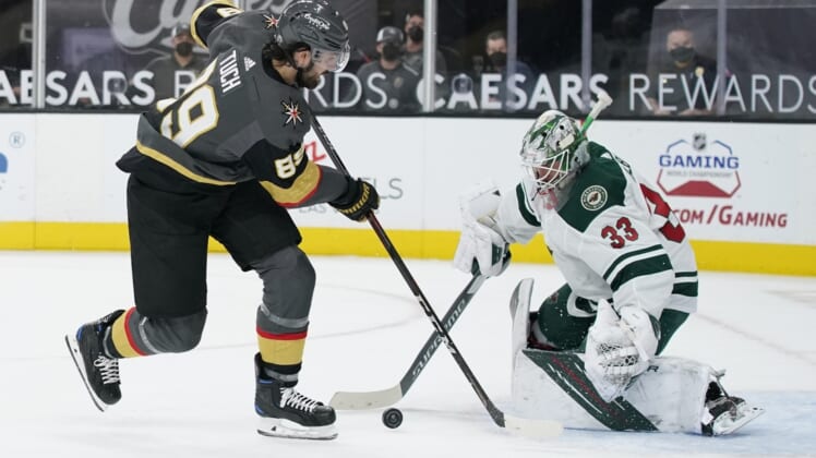 Apr 1, 2021; Las Vegas, Nevada, USA; Minnesota Wild goaltender Cam Talbot (33) blocks a shot by Vegas Golden Knights right wing Alex Tuch (89) during the second period at T-Mobile Arena. Mandatory Credit: John Locher/The Associated Press via USA TODAY Network )