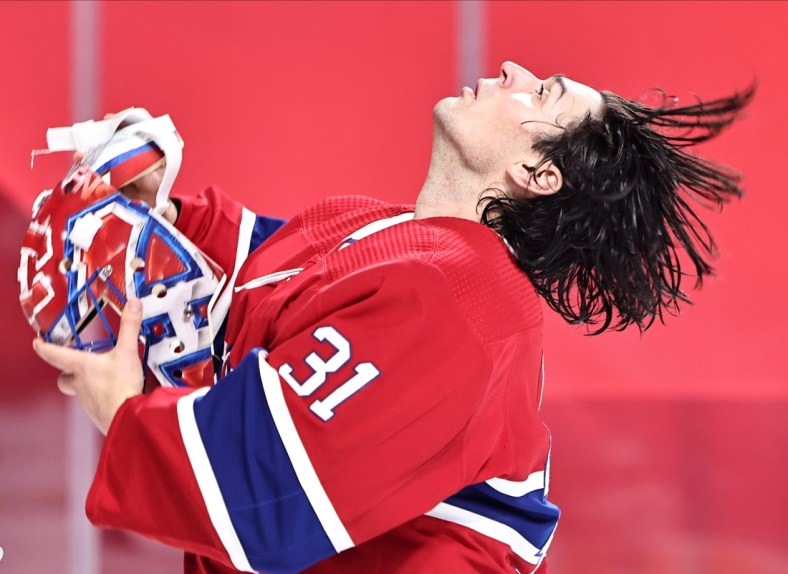 Mar 30, 2021; Montreal, Quebec, CAN; Montreal Canadiens goaltender Carey Price (31) puts his helmet on before the game against Edmonton Oilers at Bell Centre. Mandatory Credit: Jean-Yves Ahern-USA TODAY Sports