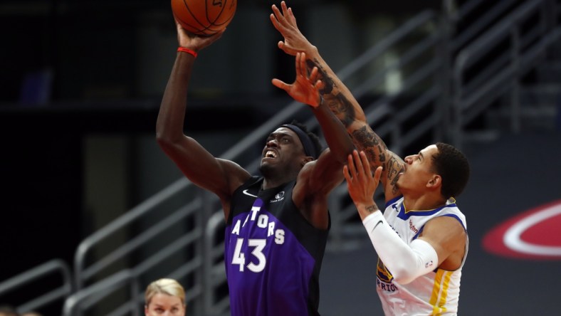 Apr 2, 2021; Tampa, Florida, USA; Toronto Raptors forward Pascal Siakam (43) shoots as Golden State Warriors forward Juan Toscano-Anderson (95) attempts to defend during the first half at Amalie Arena. Mandatory Credit: Kim Klement-USA TODAY Sports