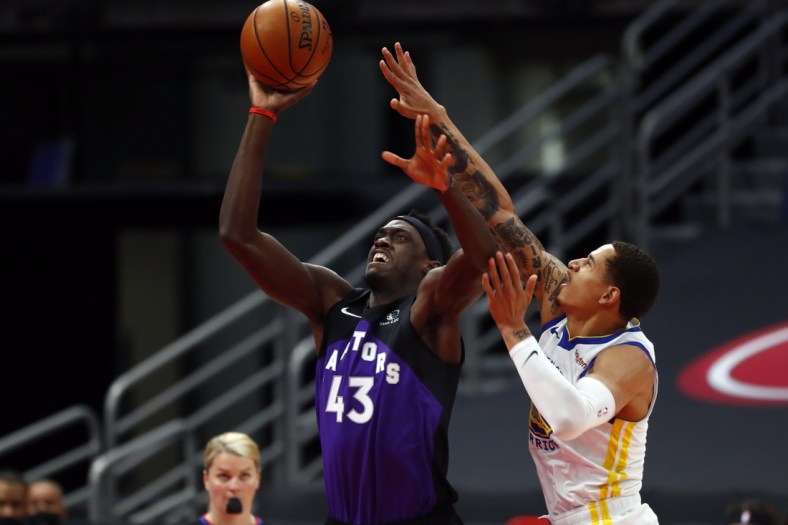 Apr 2, 2021; Tampa, Florida, USA; Toronto Raptors forward Pascal Siakam (43) shoots as Golden State Warriors forward Juan Toscano-Anderson (95) attempts to defend during the first half at Amalie Arena. Mandatory Credit: Kim Klement-USA TODAY Sports