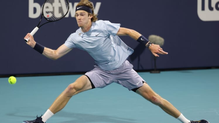 Apr 2, 2021; Miami, Florida, USA; Andrey Rublev of Russia reaches for a forehand against Hubert Hurkacz of Poland (not pictured) in a men's singles semifinal in the Miami Open at Hard Rock Stadium. Mandatory Credit: Geoff Burke-USA TODAY Sports