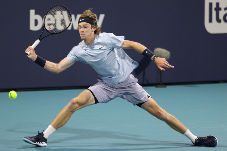 Apr 2, 2021; Miami, Florida, USA; Andrey Rublev of Russia reaches for a forehand against Hubert Hurkacz of Poland (not pictured) in a men's singles semifinal in the Miami Open at Hard Rock Stadium. Mandatory Credit: Geoff Burke-USA TODAY Sports