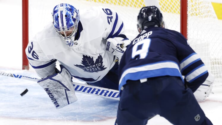 Apr 2, 2021; Winnipeg, Manitoba, CAN;  Winnipeg Jets center Andrew Copp (9) scores on Toronto Maple Leafs goaltender Jack Campbell (36) in the second period at Bell MTS Place. Mandatory Credit: James Carey Lauder-USA TODAY Sports