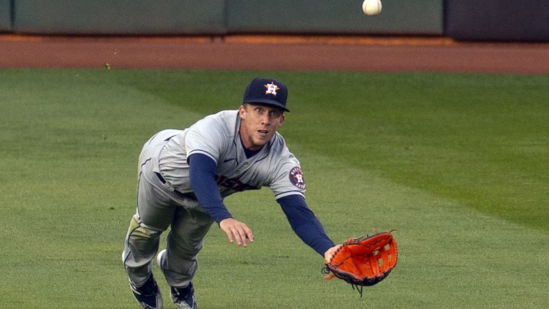 Apr 2, 2021; Oakland, California, USA; Houston Astros center fielder Myles Straw (3) makes a diving catch of a line drive off the bat of Oakland Athletics hitter Ram n Laureano during the first inning of a Major League Baseball game at RingCentral Coliseum. Mandatory Credit: D. Ross Cameron-USA TODAY Sports