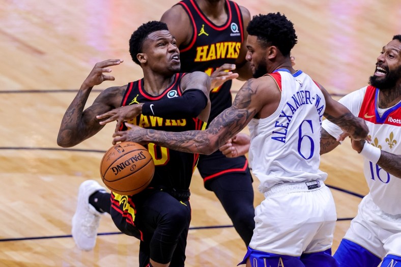 Apr 2, 2021; New Orleans, Louisiana, USA;  New Orleans Pelicans guard Nickeil Alexander-Walker (6) blocks the shot of Atlanta Hawks guard Brandon Goodwin (0) during the first half at the Smoothie King Center. Mandatory Credit: Stephen Lew-USA TODAY Sports