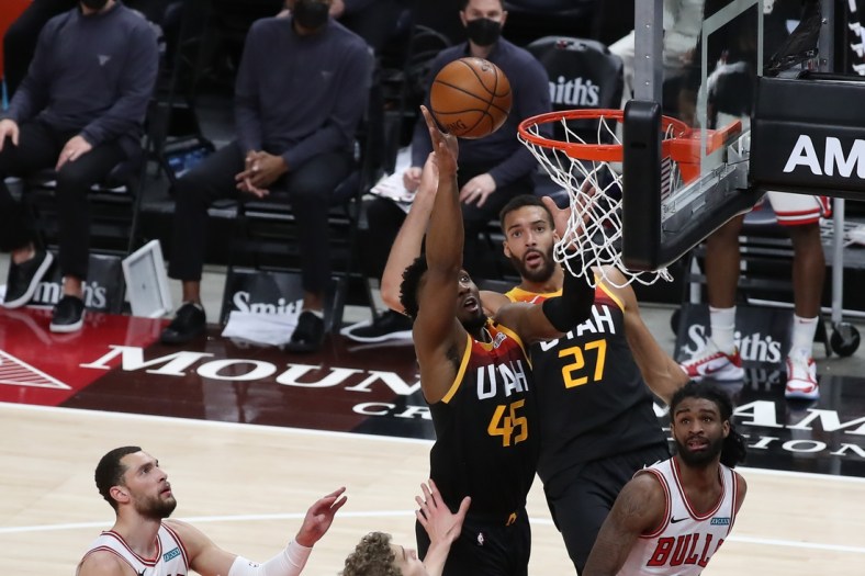 Apr 2, 2021; Salt Lake City, Utah, USA; Utah Jazz guard Donovan Mitchell (45) tips in a miss shot as the shot clock expires in the second half against the Chicago Bulls at Vivint Smart Home Arena. Mandatory Credit: Rob Gray-USA TODAY Sports