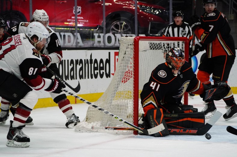Apr 2, 2021; Anaheim, California, USA; Anaheim Ducks goaltender Anthony Stolarz (41) defends the goal as Arizona Coyotes right wing Phil Kessel (81) moves in for a shot during the first period at Honda Center. Mandatory Credit: Gary A. Vasquez-USA TODAY Sports