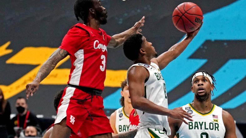 Apr 3, 2021; Indianapolis, Indiana, USA; Baylor Bears guard Jared Butler (12) shoots the ball against Houston Cougars guard DeJon Jarreau (3) during the first half in the national semifinals of the Final Four of the 2021 NCAA Tournament at Lucas Oil Stadium. Mandatory Credit: Kyle Terada-USA TODAY Sports