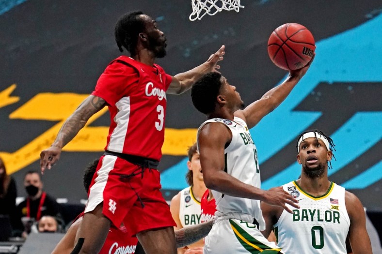 Apr 3, 2021; Indianapolis, Indiana, USA; Baylor Bears guard Jared Butler (12) shoots the ball against Houston Cougars guard DeJon Jarreau (3) during the first half in the national semifinals of the Final Four of the 2021 NCAA Tournament at Lucas Oil Stadium. Mandatory Credit: Kyle Terada-USA TODAY Sports