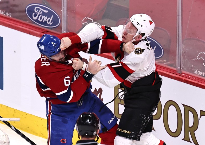 Apr 3, 2021; Montreal, Quebec, CAN; Montreal Canadiens defenseman Shea Weber (6) and Ottawa Senators left wing Brady Tkachuk (7) fight during the first period at Bell Centre. Mandatory Credit: Jean-Yves Ahern-USA TODAY Sports
