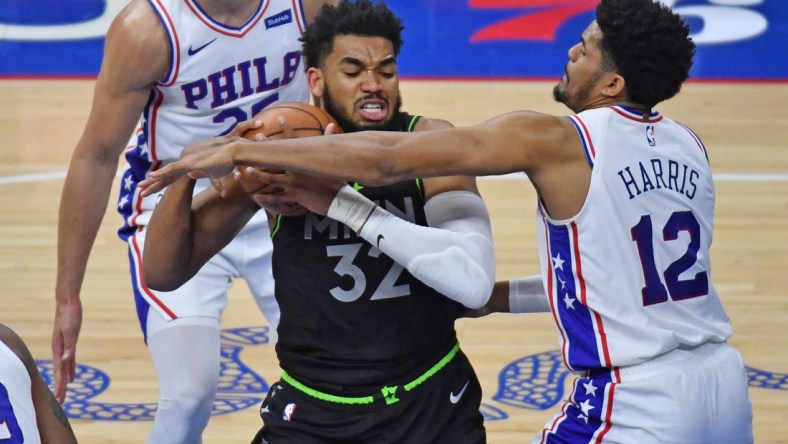 Apr 3, 2021; Philadelphia, Pennsylvania, USA; Minnesota Timberwolves center Karl-Anthony Towns (32) battles with Philadelphia 76ers forward Tobias Harris (12) during the second quarter at Wells Fargo Center. Mandatory Credit: Eric Hartline-USA TODAY Sports