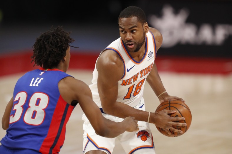 Apr 3, 2021; Detroit, Michigan, USA; New York Knicks guard Alec Burks (18) gets defended by Detroit Pistons guard Saben Lee (38) during the second quarter at Little Caesars Arena. Mandatory Credit: Raj Mehta-USA TODAY Sports