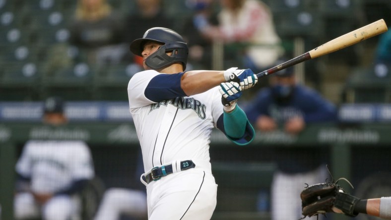 Apr 3, 2021; Seattle, Washington, USA; Seattle Mariners second baseman Ty France (23) hits a solo home run against the San Francisco Giants during the third inning at T-Mobile Park. Mandatory Credit: Joe Nicholson-USA TODAY Sports