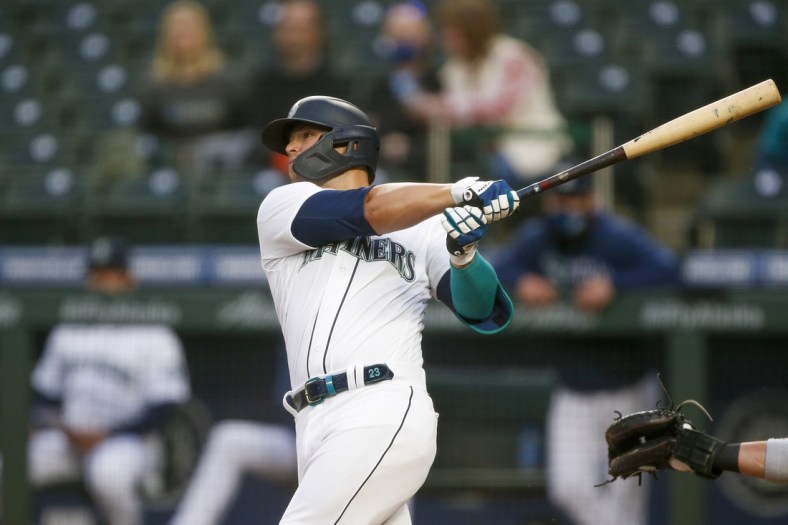 Apr 3, 2021; Seattle, Washington, USA; Seattle Mariners second baseman Ty France (23) hits a solo home run against the San Francisco Giants during the third inning at T-Mobile Park. Mandatory Credit: Joe Nicholson-USA TODAY Sports