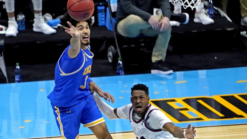 Apr 3, 2021; Indianapolis, Indiana, USA; UCLA Bruins guard Johnny Juzang (3) and Gonzaga Bulldogs guard Joel Ayayi (11) go for the ball during the second half in the national semifinals of the Final Four of the 2021 NCAA Tournament at Lucas Oil Stadium. Mandatory Credit: Robert Deutsch-USA TODAY Sports