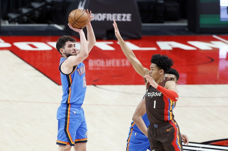 Apr 3, 2021; Portland, Oregon, USA; Oklahoma City Thunder shooting guard Ty Jerome (16) shoots the ball over Portland Trail Blazers shooting guard Anfernee Simons (1) during the first half at Moda Center. Mandatory Credit: Soobum Im-USA TODAY Sports