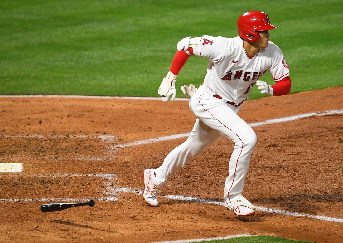 Apr 3, 2021; Anaheim, California, USA; Los Angeles Angels designated hitter Shohei Ohtani (17) runs to first base after hitting  a single against the Chicago White Sox in the fifth Inning at Angel Stadium. Mandatory Credit: Jayne Kamin-Oncea-USA TODAY Sports