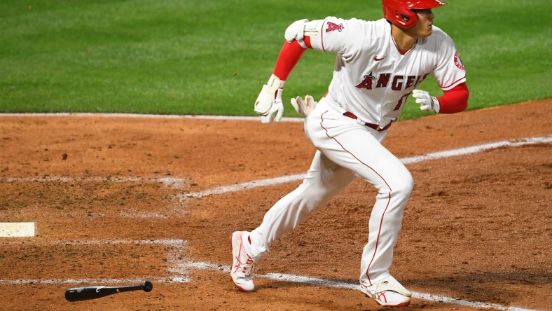 Apr 3, 2021; Anaheim, California, USA; Los Angeles Angels designated hitter Shohei Ohtani (17) runs to first base after hitting  a single against the Chicago White Sox in the fifth Inning at Angel Stadium. Mandatory Credit: Jayne Kamin-Oncea-USA TODAY Sports