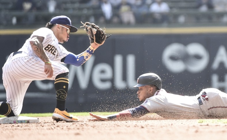 Apr 4, 2021; Milwaukee, Wisconsin, USA; Milwaukee Brewers second baseman Kolten Wong (16) gets ready to tag out Minnesota Twins second baseman Jorge Polanco (11) trying to steal 2nd base in the third inning at American Family Field. Mandatory Credit: Benny Sieu-USA TODAY Sports