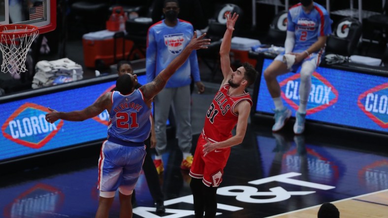 Apr 4, 2021; Chicago, Illinois, USA; Chicago Bulls guard Tomas Satoransky (31) scores over Brooklyn Nets center LaMarcus Aldridge (21) during the third quarter at the United Center. Mandatory Credit: Dennis Wierzbicki-USA TODAY Sports