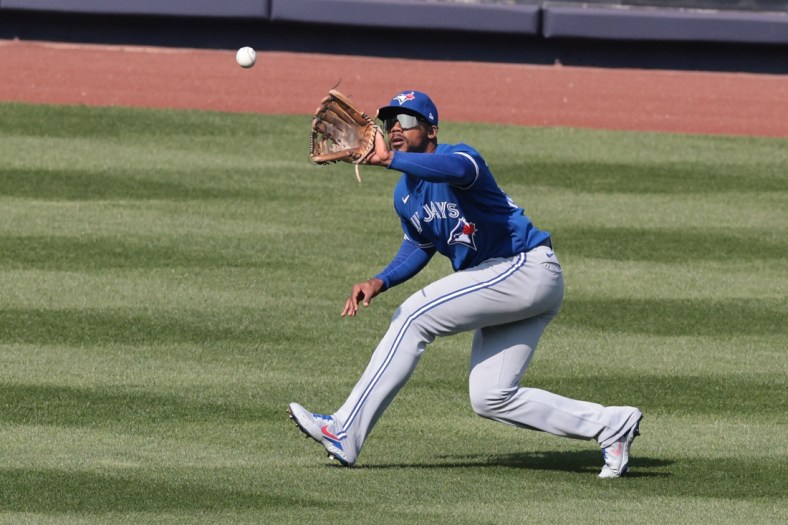 Apr 4, 2021; Bronx, New York, USA; Toronto Blue Jays right fielder Teoscar Hernandez (37) makes a catch for an out during the ninth inning against the New York Yankees at Yankee Stadium. Mandatory Credit: Vincent Carchietta-USA TODAY Sports