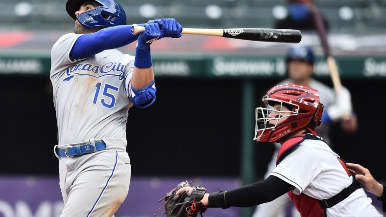 Apr 5, 2021; Cleveland, Ohio, USA; Kansas City Royals second baseman Whit Merrifield (15) hits a sacrifice fly during the seventh inning against the Cleveland Indians at Progressive Field. Mandatory Credit: Ken Blaze-USA TODAY Sports