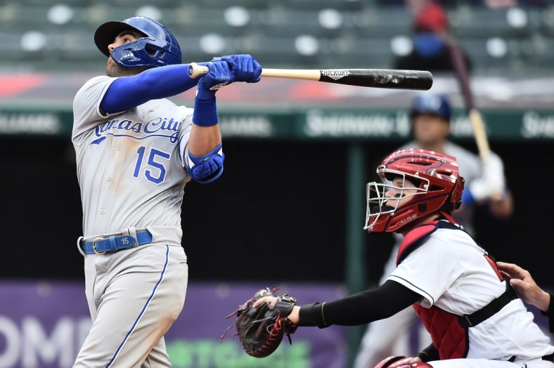Apr 5, 2021; Cleveland, Ohio, USA; Kansas City Royals second baseman Whit Merrifield (15) hits a sacrifice fly during the seventh inning against the Cleveland Indians at Progressive Field. Mandatory Credit: Ken Blaze-USA TODAY Sports