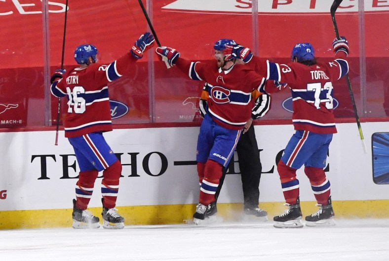 Apr 5, 2021; Montreal, Quebec, CAN; Montreal Canadiens forward Eric Staal (21) reacts with teammates including defenseman Jeff Petry (26) and forward Tyler Toffoli (73) after scoring the winning goal against the Edmonton Oilers during the overtime period at the Bell Centre. Mandatory Credit: Eric Bolte-USA TODAY Sports