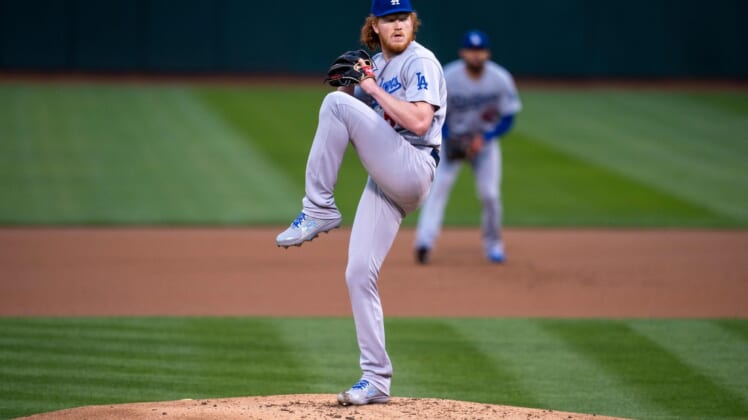Apr 5, 2021; Oakland, California, USA; Los Angeles Dodgers starting pitcher Dustin May (85) delivers a pitch against the Oakland Athletics during the first inning at RingCentral Coliseum. Mandatory Credit: Neville E. Guard-USA TODAY Sports