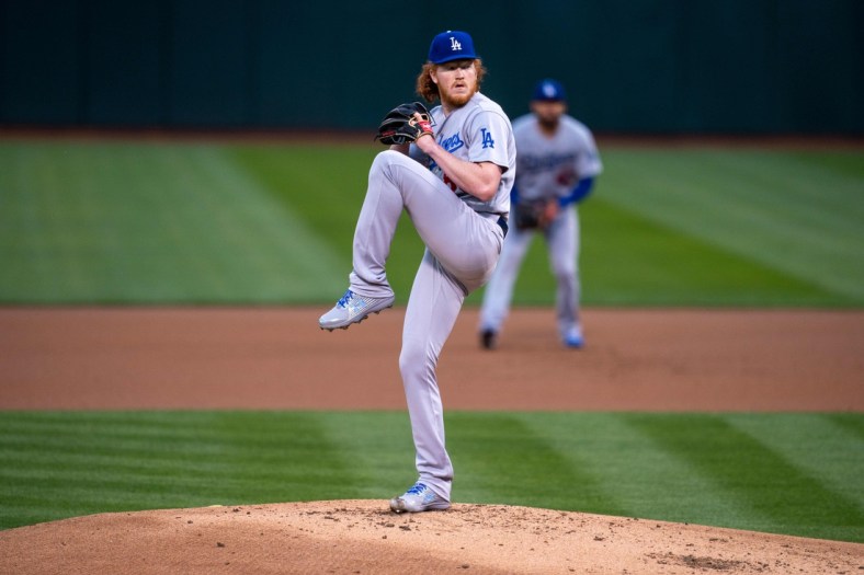 Apr 5, 2021; Oakland, California, USA; Los Angeles Dodgers starting pitcher Dustin May (85) delivers a pitch against the Oakland Athletics during the first inning at RingCentral Coliseum. Mandatory Credit: Neville E. Guard-USA TODAY Sports