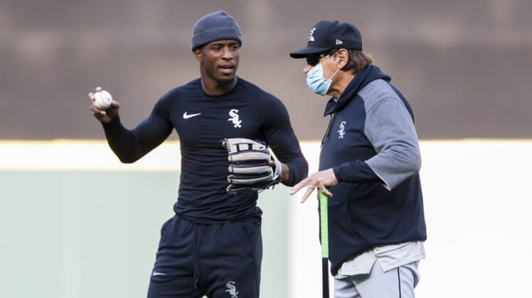 Apr 5, 2021; Seattle, Washington, USA; Chicago White Sox shortstop Tim Anderson (left) and manager Tony La Russa (22) talk during pregame warmups before a game against the Seattle Mariners at T-Mobile Park. Mandatory Credit: Joe Nicholson-USA TODAY Sports