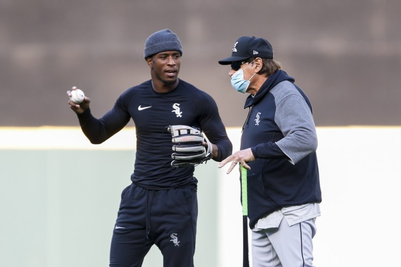 Apr 5, 2021; Seattle, Washington, USA; Chicago White Sox shortstop Tim Anderson (left) and manager Tony La Russa (22) talk during pregame warmups before a game against the Seattle Mariners at T-Mobile Park. Mandatory Credit: Joe Nicholson-USA TODAY Sports