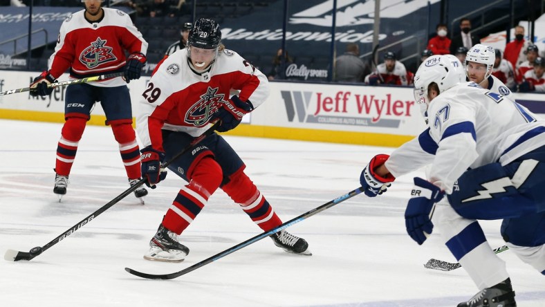 Apr 6, 2021; Columbus, Ohio, USA; Columbus Blue Jackets right wing Patrik Laine (29) shoots the puck as Tampa Bay Lightning defenseman Victor Hedman (77) defends during the first period at Nationwide Arena. Mandatory Credit: Russell LaBounty-USA TODAY Sports