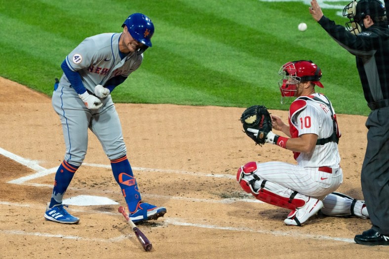Apr 6, 2021; Philadelphia, Pennsylvania, USA; The New York Mets' J.D. Davis (28) reacts in front of Philadelphia Phillies catcher J.T. Realmuto (10) after being hit by a pitch during the first inning at Citizens Bank Park. Mandatory Credit: Bill Streicher-USA TODAY Sports