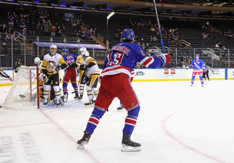 Apr 6, 2021; New York, New York, USA;  Alexis Lafreniere #13 of the New York Rangers celebrates his goal at 12:20 of the second period against the Pittsburgh Penguins at Madison Square Garden on April 06, 2021 in New York City. Mandatory Credit:  Bruce Bennett/POOL PHOTOS-USA TODAY Sports