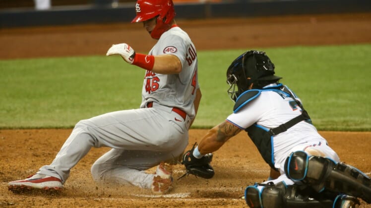 Apr 6, 2021; Miami, Florida, USA; St. Louis Cardinals first baseman Paul Goldschmidt (46) slides at home plate to score a run against the Miami Marlins in the sixth inning at loanDepot Park. Mandatory Credit: Sam Navarro-USA TODAY Sports