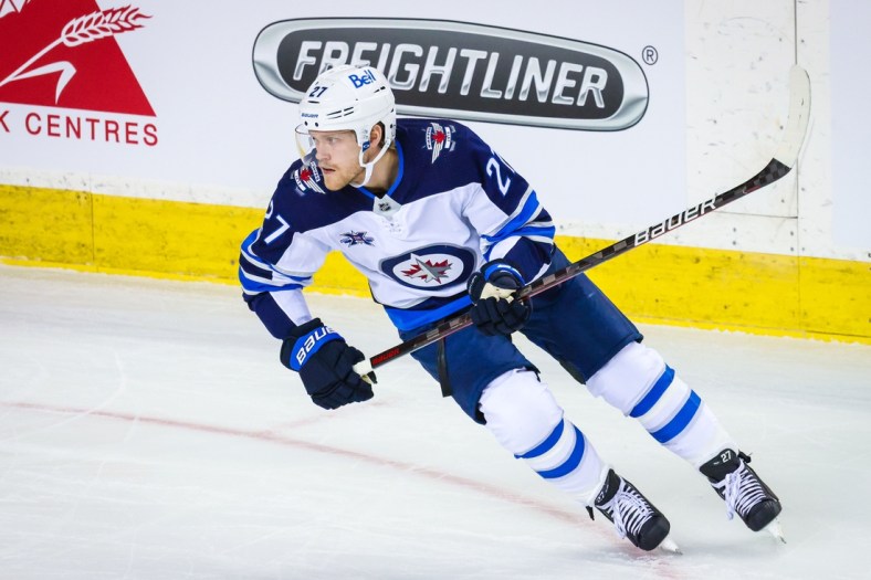 Mar 26, 2021; Calgary, Alberta, CAN; Winnipeg Jets left wing Nikolaj Ehlers (27) skates against the Calgary Flames during the first period at Scotiabank Saddledome. Mandatory Credit: Sergei Belski-USA TODAY Sports