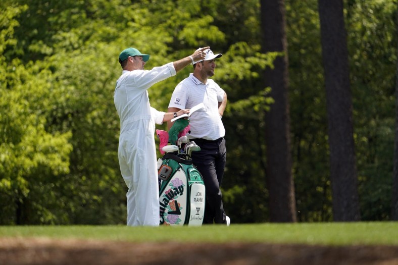 Apr 7, 2021; Augusta, GA, USA; Jon Rahm with caddie Adam Hayes on the 11th hole during a practice round for The Masters golf tournament at Augusta National Golf Club. Mandatory Credit: Rob Schumacher-USA TODAY Sports