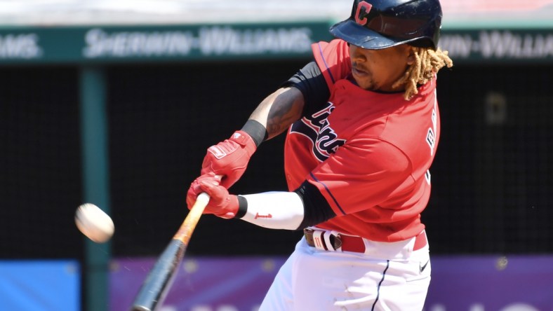 Apr 7, 2021; Cleveland, Ohio, USA; Cleveland Indians third baseman Jose Ramirez (11) hits a two run home run during the sixth inning against the Kansas City Royals at Progressive Field. Mandatory Credit: Ken Blaze-USA TODAY Sports