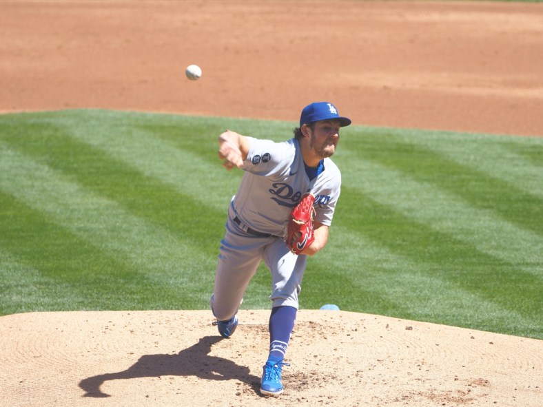 Apr 7, 2021; Oakland, California, USA; Los Angeles Dodgers starting pitcher Trevor Bauer (27) pitches the ball against the Oakland Athletics during the first inning at RingCentral Coliseum. Mandatory Credit: Kelley L Cox-USA TODAY Sports