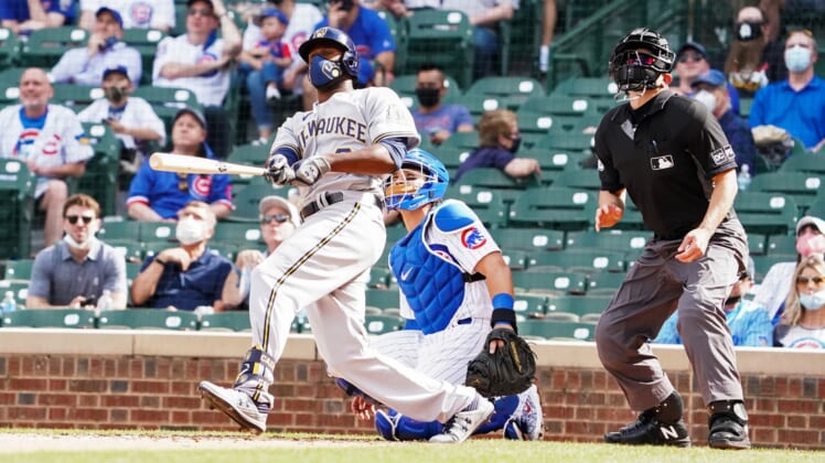 Apr 7, 2021; Chicago, Illinois, USA; Milwaukee Brewers center fielder Lorenzo Cain (6) hits a home run against the Chicago Cubs during the eighth inning  at Wrigley Field. Mandatory Credit: David Banks-USA TODAY Sports