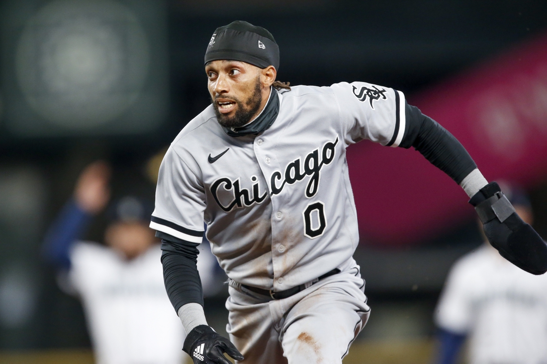 Apr 7, 2021; Seattle, Washington, USA; Chicago White Sox left fielder Billy Hamilton (0) runs back to first during an infield fly against the Seattle Mariners during the fifth inning at T-Mobile Park. Mandatory Credit: Joe Nicholson-USA TODAY Sports