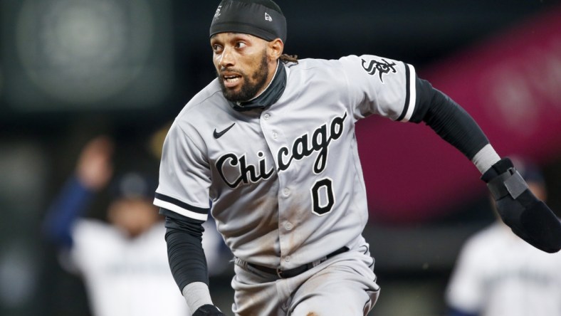 Apr 7, 2021; Seattle, Washington, USA; Chicago White Sox left fielder Billy Hamilton (0) runs back to first during an infield fly against the Seattle Mariners during the fifth inning at T-Mobile Park. Mandatory Credit: Joe Nicholson-USA TODAY Sports