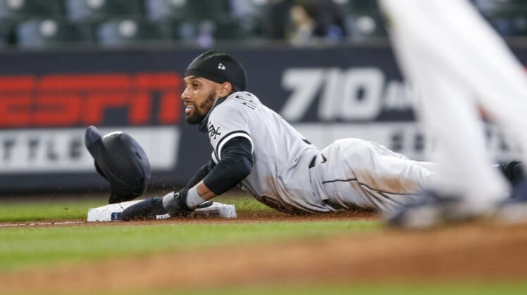 Apr 7, 2021; Seattle, Washington, USA; Chicago White Sox left fielder Billy Hamilton (0) steals third base against the Seattle Mariners during the fifth inning at T-Mobile Park. Mandatory Credit: Joe Nicholson-USA TODAY Sports
