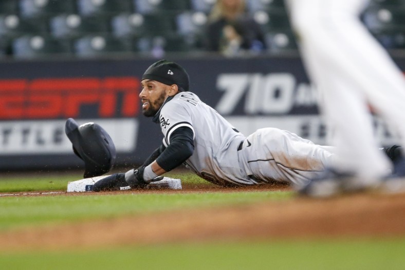 Apr 7, 2021; Seattle, Washington, USA; Chicago White Sox left fielder Billy Hamilton (0) steals third base against the Seattle Mariners during the fifth inning at T-Mobile Park. Mandatory Credit: Joe Nicholson-USA TODAY Sports
