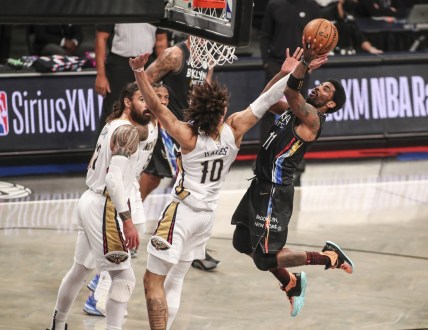 Apr 7, 2021; Brooklyn, New York, USA;  Brooklyn Nets guard Kyrie Irving (11) goes in for a layup in the second quarter against the New Orleans Pelicans at Barclays Center. Mandatory Credit: Wendell Cruz-USA TODAY Sports